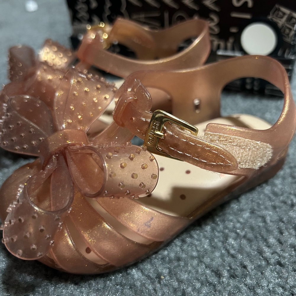 Gently used Toddler sandals size 7T; comes with dust bag and original box.